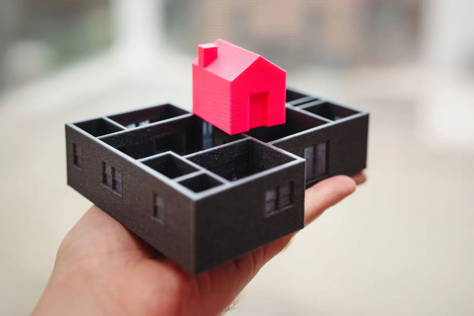 A model house above its floor plan — the building model is where PropStudioOS starts